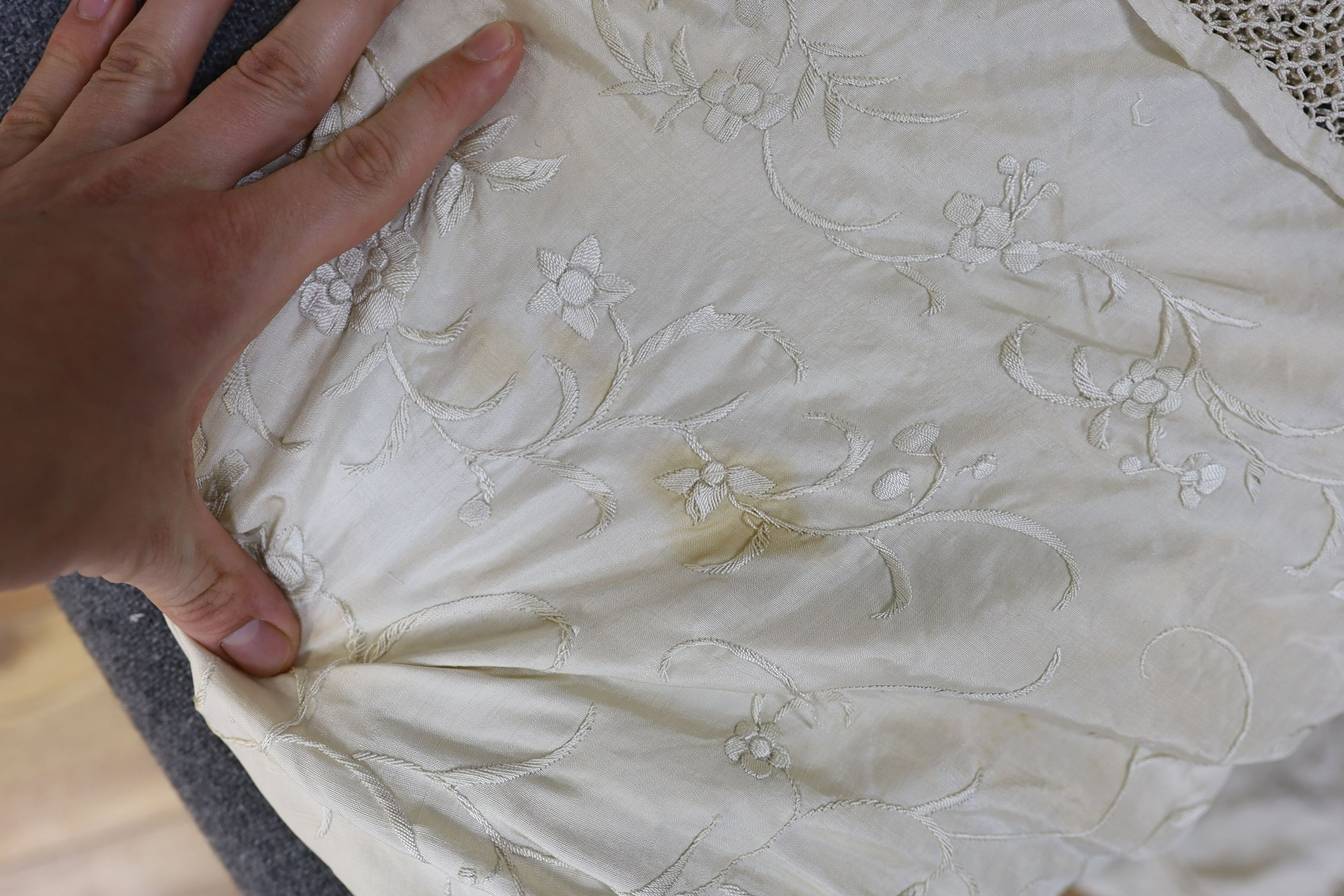 A 19th century cream embroidery on cream silk shawl together with a smaller later shawl